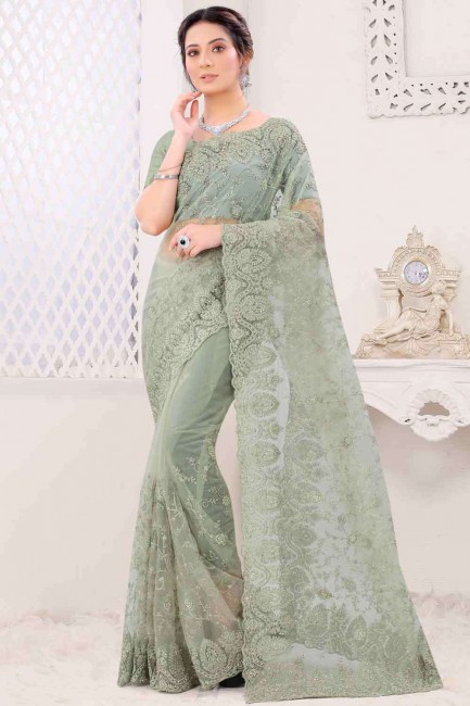 Fashionable Net Wedding Saree in Dusty pista with Resham Work