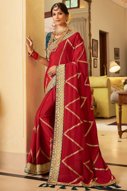 Saree in Red Crepe and silk with Lace