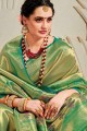 Opulent Banarasi raw Silk Banarasi Saree in Green with Weaving