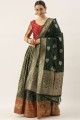 Party Lehenga Choli in Green Banarasi silk with Weaving